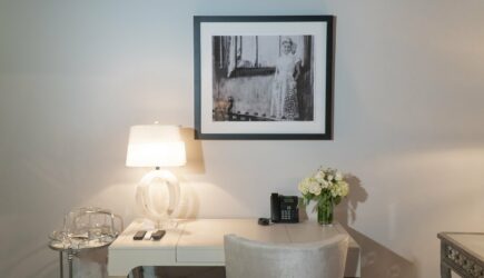 Stedman Suite desk with black and white picture of a woman on wall above in Stonehurst Place