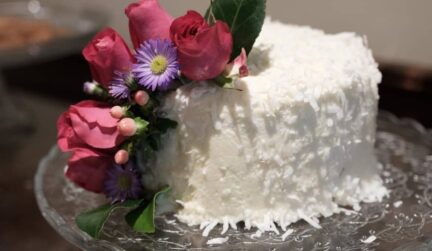 Wedding cake with flowers on top in Stonehurst Place